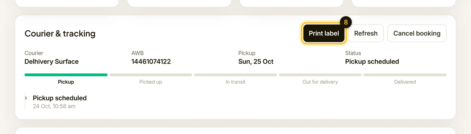 A booked shipment with the courier, tracking number, pickup date and the Print label button